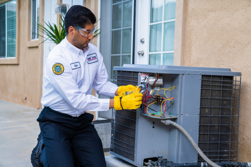 How Installing a New HVAC Increases Home Value - licensed HVAC professional installing AC