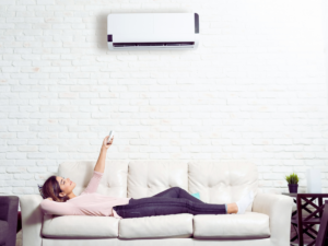 homeowner enjoying cool air from mini-split ductless system