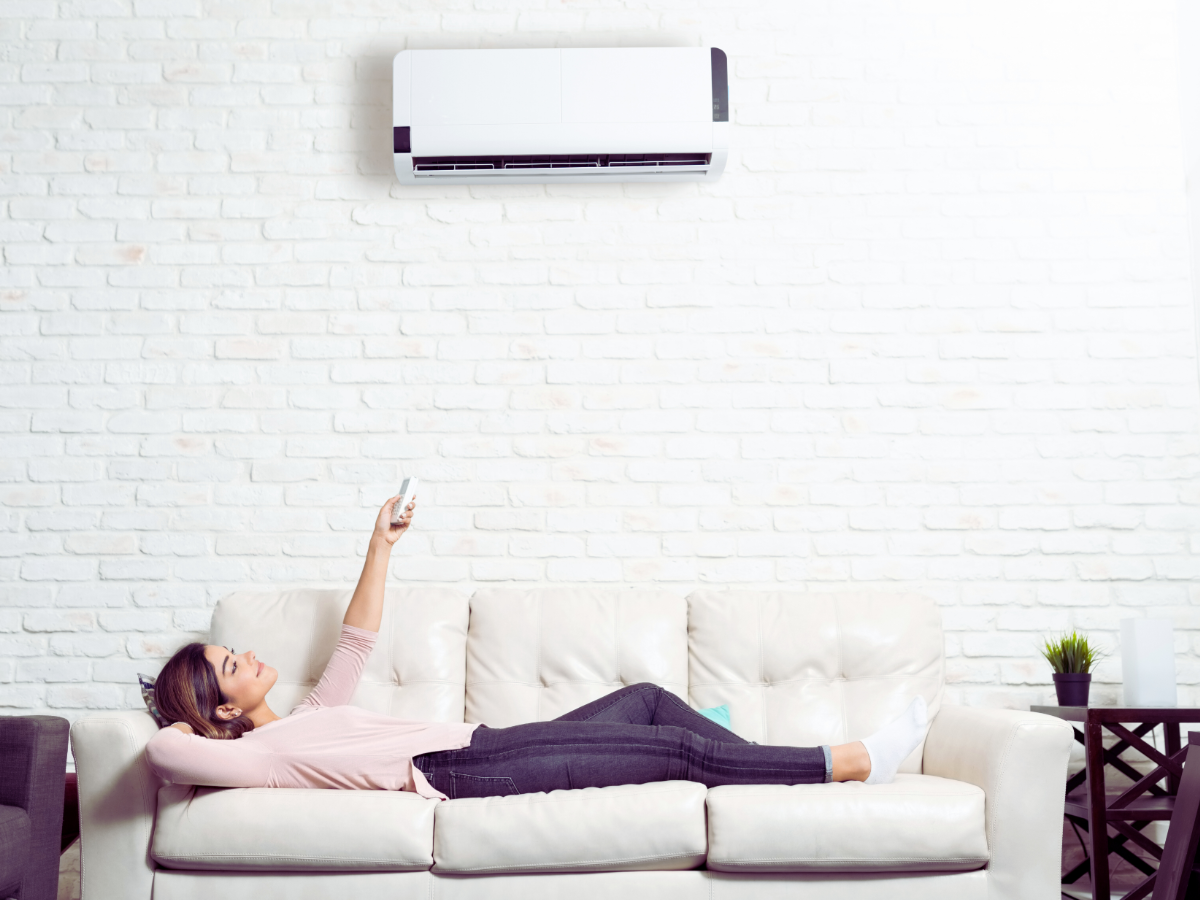 homeowner enjoying a mini-split ductless system