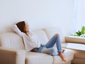 Woman enjoying benefits of properly sized dehumidifier