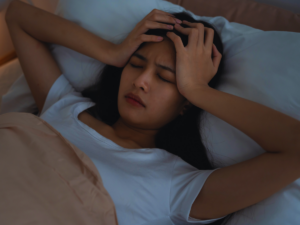 Woman who can't sleep because of poor indoor air quality